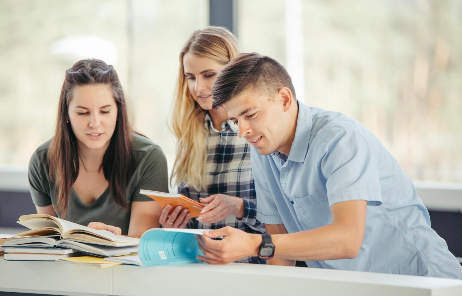 Modern financial workspace with laptop, documents, and planning materials